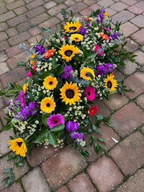 Bright Coloured Sunflower Coffin Spray